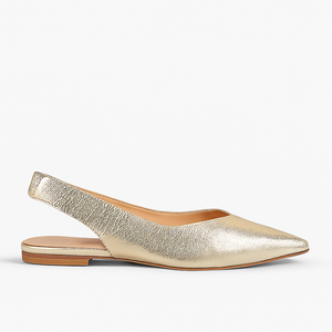 Gold metallic slingback flat shoe on a white background