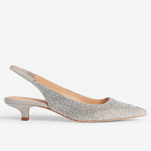 Silver glittery slingback shoe on a white background