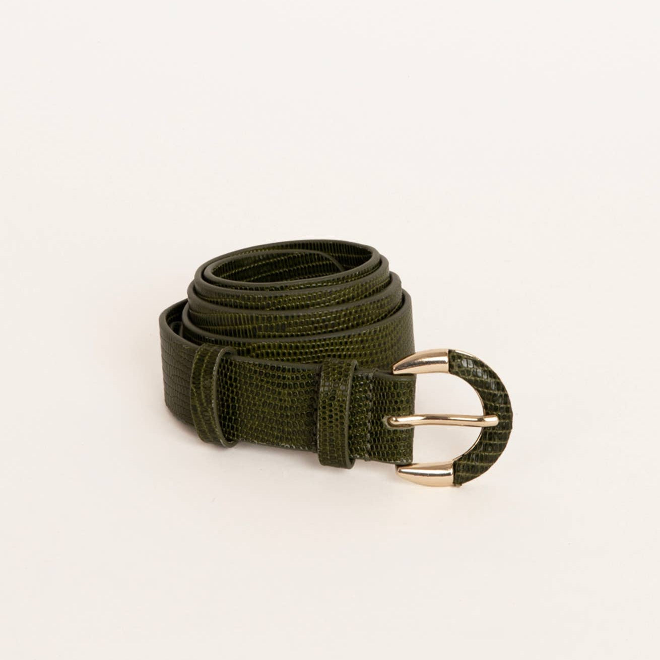 Green belt with a gold buckle on a white background