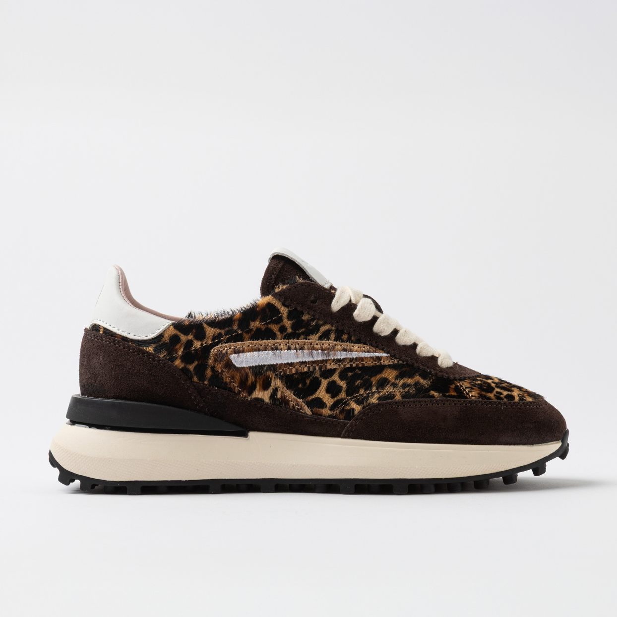 Sneaker with leopard print pattern on a white background