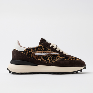 Sneaker with leopard print pattern on a white background
